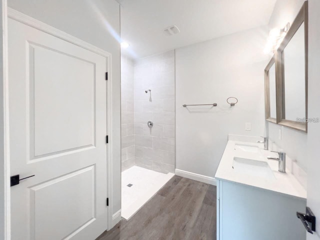 35 Pecan Run Crse, Ocala, FL 34472 - full bath with double vanity, tiled shower, and wood finished floors