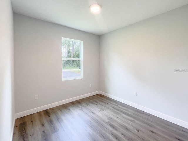 35 Pecan Run Crse, Ocala, FL 34472 - empty room with wood finished floors and baseboards