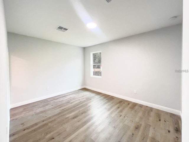 35 Pecan Run Crse, Ocala, FL 34472 - spare room featuring baseboards and wood finished floors