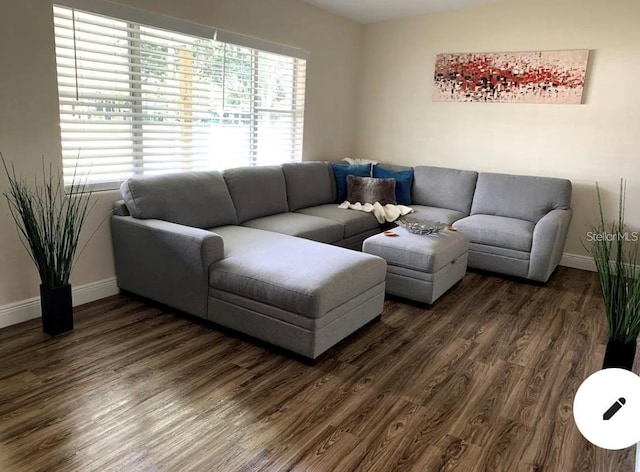 2940 Lake Margaret Dr, Orlando, FL 32806 - living room with baseboards and dark wood-type flooring