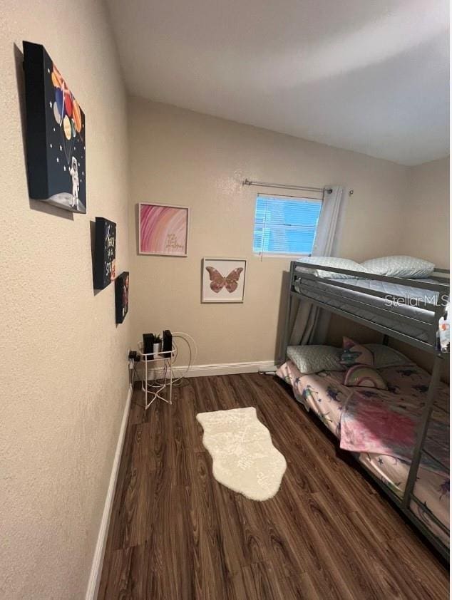2940 Lake Margaret Dr, Orlando, FL 32806 - bedroom with wood finished floors and baseboards