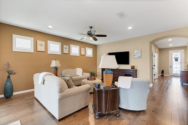802 Soria Ln, Davenport, FL 33837 - living area with arched walkways, a ceiling fan, hardwood / wood-style floors, and recessed lighting