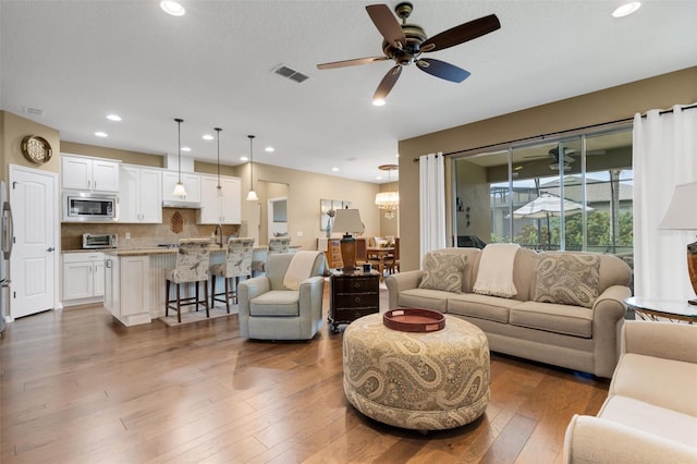 802 Soria Ln, Davenport, FL 33837 - living area with ceiling fan, recessed lighting, and wood finished floors