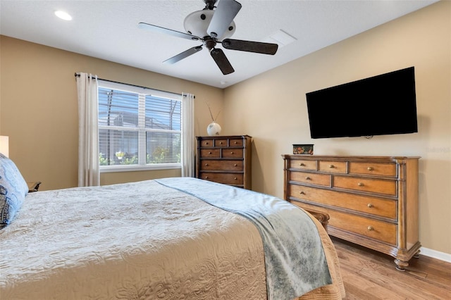 802 Soria Ln, Davenport, FL 33837 - bedroom featuring wood finished floors, ceiling fan, and recessed lighting