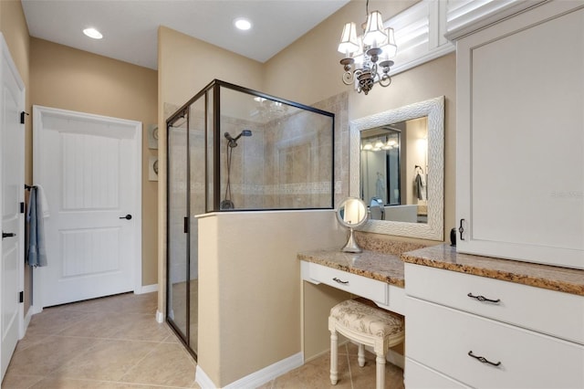 802 Soria Ln, Davenport, FL 33837 - bathroom with a stall shower, a chandelier, vanity, tile patterned flooring, and recessed lighting