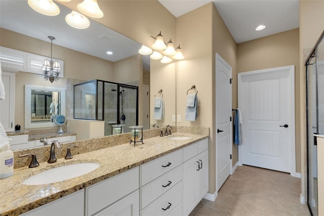 802 Soria Ln, Davenport, FL 33837 - full bath with a chandelier, a shower stall, double vanity, and tile patterned floors