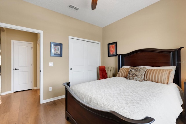 802 Soria Ln, Davenport, FL 33837 - bedroom featuring wood finished floors, a closet, and a ceiling fan