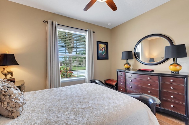 802 Soria Ln, Davenport, FL 33837 - bedroom featuring multiple windows, wood finished floors, and a ceiling fan