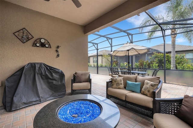 802 Soria Ln, Davenport, FL 33837 - view of patio / terrace with ceiling fan, an outdoor living space with a fire pit, and glass enclosure