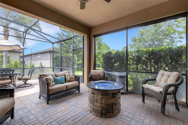 802 Soria Ln, Davenport, FL 33837 - sunroom / solarium featuring a ceiling fan and an outdoor living space with a fire pit