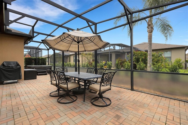 802 Soria Ln, Davenport, FL 33837 - view of patio with a hot tub, glass enclosure, grilling area, and outdoor dining area