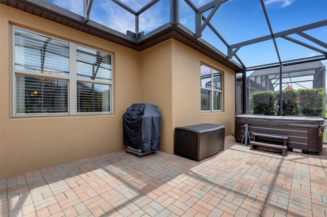 802 Soria Ln, Davenport, FL 33837 - view of patio / terrace featuring a hot tub, glass enclosure, and grilling area