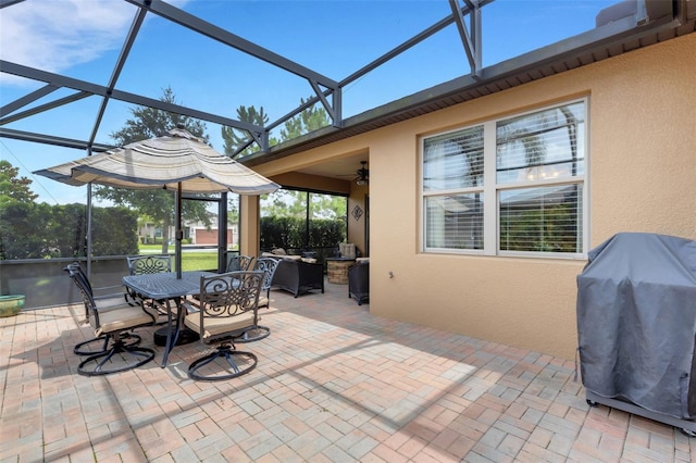 802 Soria Ln, Davenport, FL 33837 - view of patio / terrace featuring area for grilling, glass enclosure, ceiling fan, and outdoor dining area