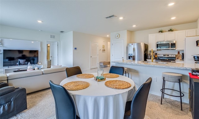 320 Boardwalk Ave, Haines City, FL 33844 - dining area with recessed lighting and light colored carpet