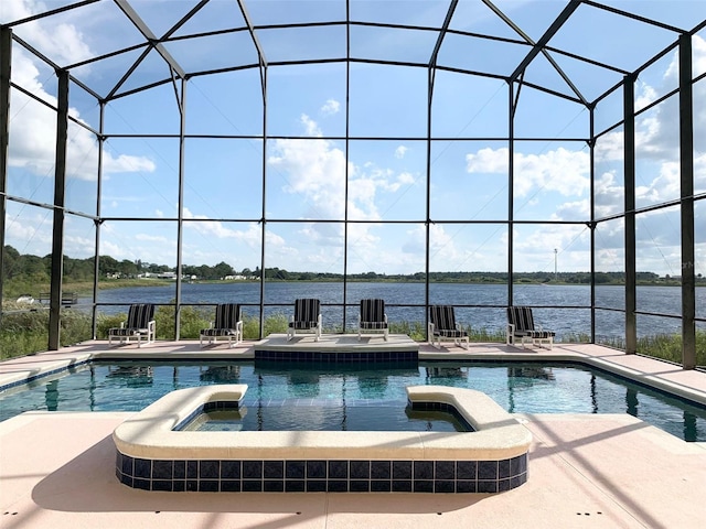 352 Cherokee Ave, Haines City, FL 33844 - view of pool featuring a pool with connected hot tub, a patio area, and a water view