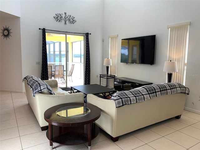 352 Cherokee Ave, Haines City, FL 33844 - living room featuring light tile patterned flooring and a towering ceiling
