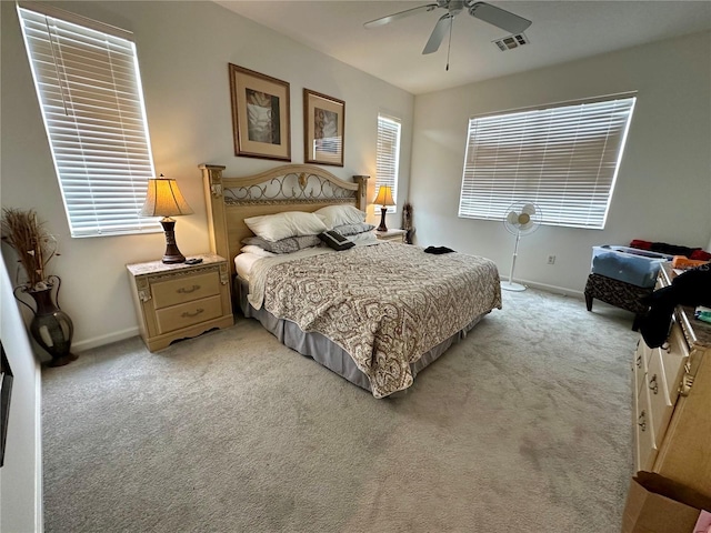 352 Cherokee Ave, Haines City, FL 33844 - bedroom with light colored carpet and a ceiling fan