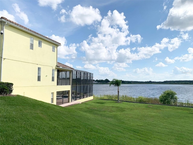 352 Cherokee Ave, Haines City, FL 33844 - view of grassy yard with a sunroom and a water view