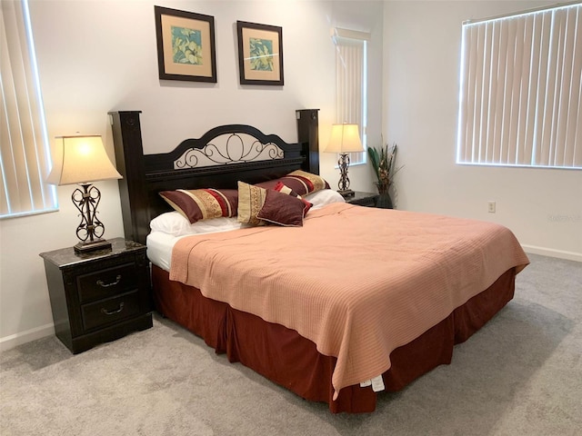 352 Cherokee Ave, Haines City, FL 33844 - bedroom featuring light carpet and baseboards