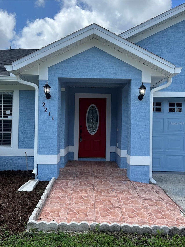 2211 Julianna Ct, Saint Cloud, FL 34769 - view of exterior entry with brick siding and a garage