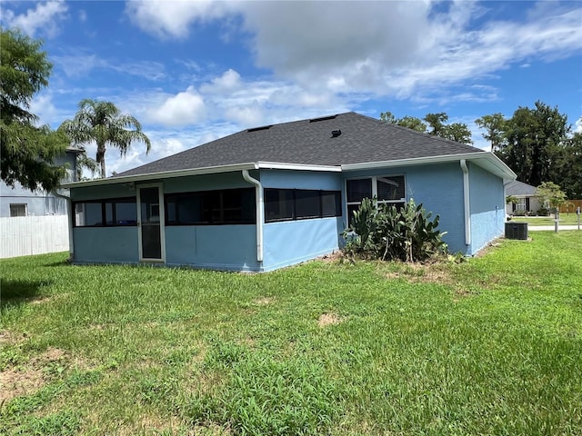 2211 Julianna Ct, Saint Cloud, FL 34769 - rear view of house featuring a sunroom and roof with shingles