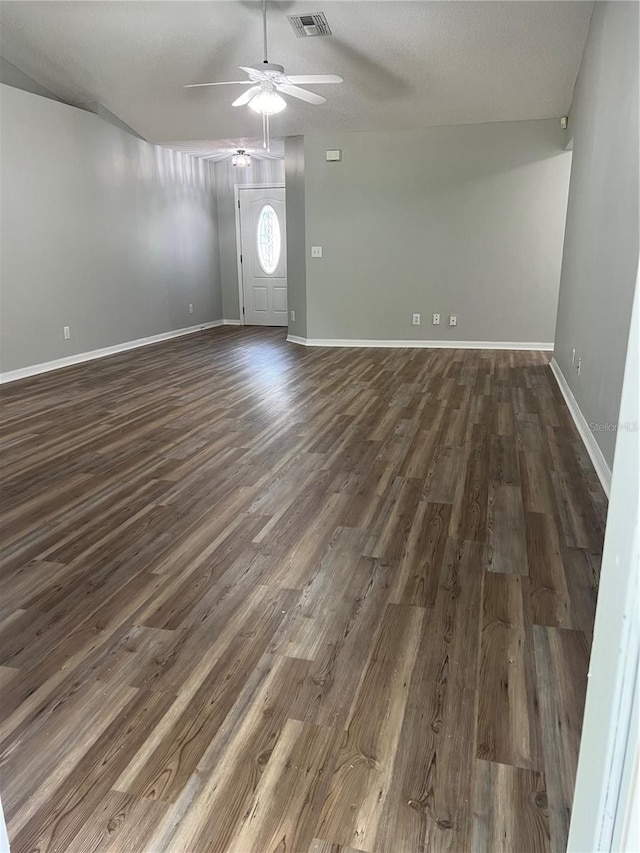 2211 Julianna Ct, Saint Cloud, FL 34769 - unfurnished living room with dark wood-style flooring and a ceiling fan