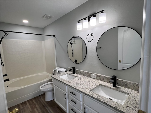 2211 Julianna Ct, Saint Cloud, FL 34769 - full bath featuring shower / bath combination, wood finished floors, and double vanity