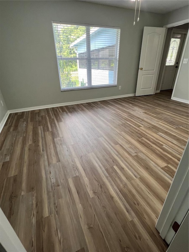 2211 Julianna Ct, Saint Cloud, FL 34769 - spare room featuring dark wood-type flooring