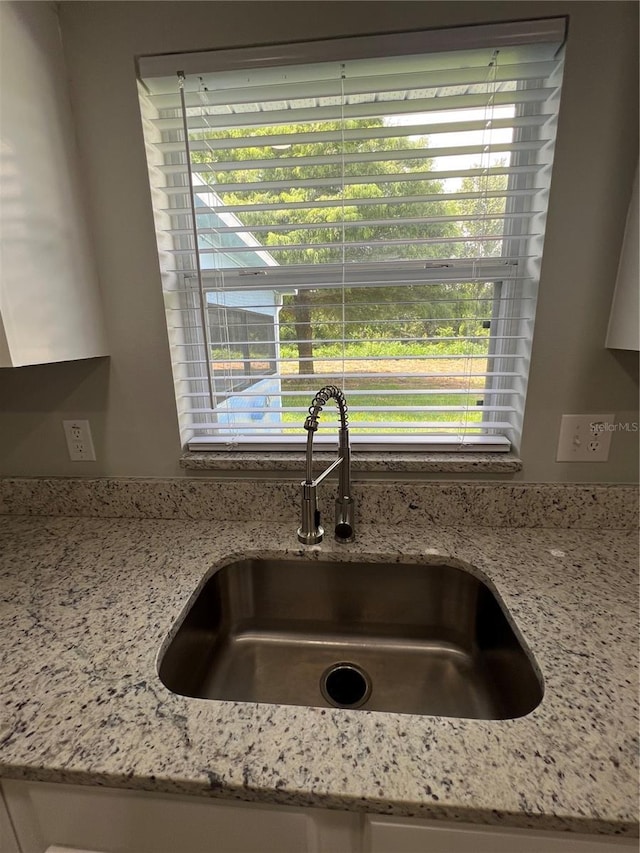 2211 Julianna Ct, Saint Cloud, FL 34769 - kitchen view of a sink and light stone countertops