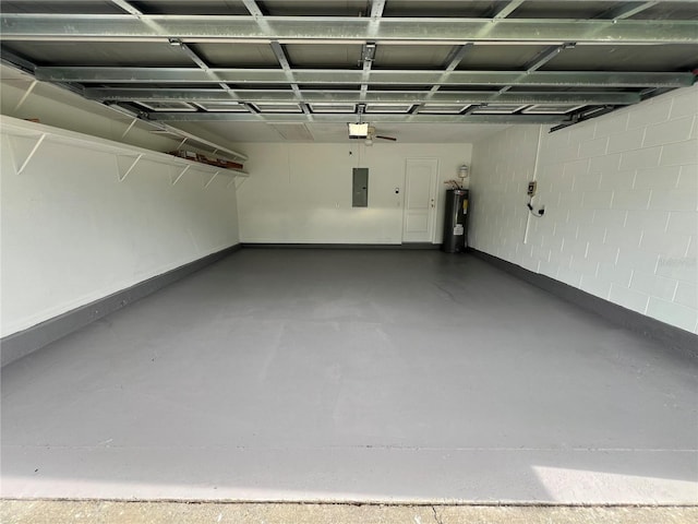 2211 Julianna Ct, Saint Cloud, FL 34769 - garage featuring electric panel, water heater, a garage door opener, and concrete block wall
