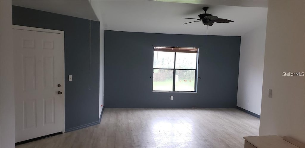 2002 Cascades Blvd Unit 202, Kissimmee, FL 34741 - unfurnished room featuring wood finished floors and a ceiling fan