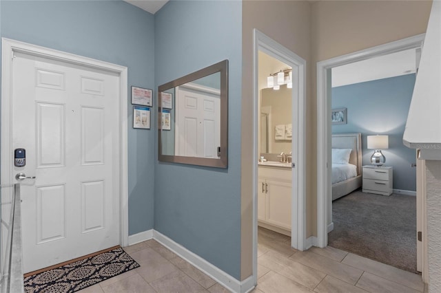 4840 Romeo Cir, Kissimmee, FL 34746 - foyer entrance with light tile patterned floors and light colored carpet