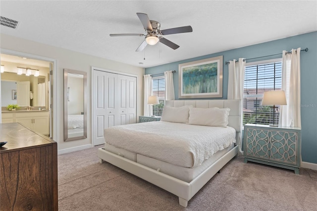 4840 Romeo Cir, Kissimmee, FL 34746 - carpeted bedroom featuring ensuite bath, a closet, and ceiling fan