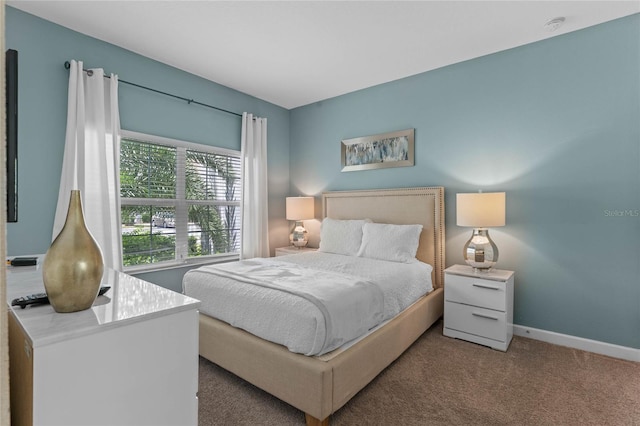 4840 Romeo Cir, Kissimmee, FL 34746 - carpeted bedroom featuring baseboards