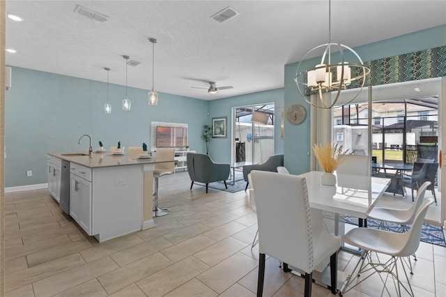 4840 Romeo Cir, Kissimmee, FL 34746 - dining area featuring a chandelier and ceiling fan
