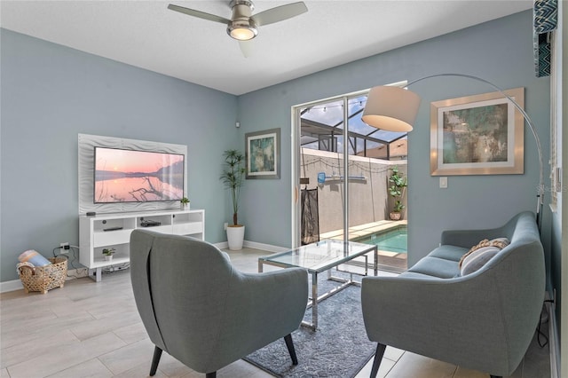 4840 Romeo Cir, Kissimmee, FL 34746 - living area featuring ceiling fan and baseboards
