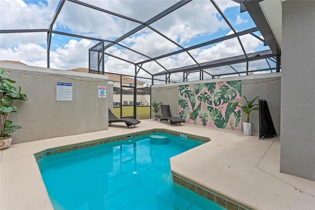 4840 Romeo Cir, Kissimmee, FL 34746 - outdoor pool featuring glass enclosure and a patio area