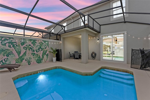 4840 Romeo Cir, Kissimmee, FL 34746 - pool at dusk featuring an outdoor pool