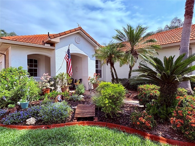 99 Auburn Dr, Kissimmee, FL 34759 - mediterranean / spanish-style home featuring a tile roof and stucco siding