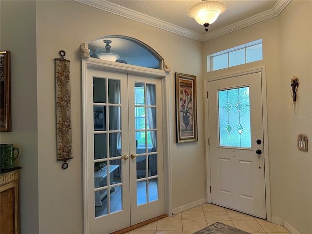 99 Auburn Dr, Kissimmee, FL 34759 - foyer entrance with ornamental molding, light tile patterned floors, and french doors