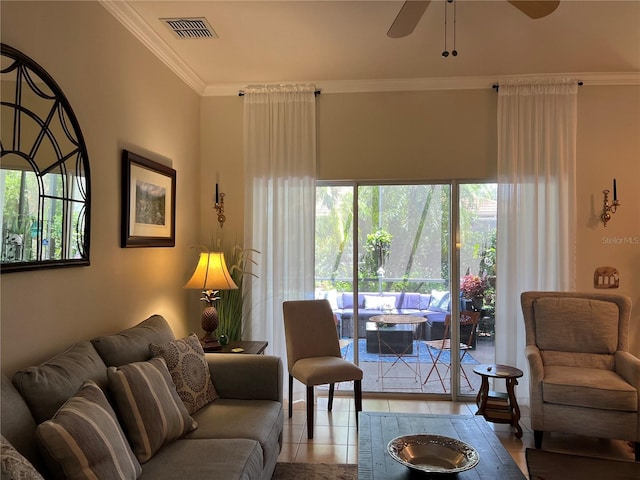 99 Auburn Dr, Kissimmee, FL 34759 - living area with crown molding and a ceiling fan