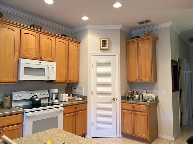 99 Auburn Dr, Kissimmee, FL 34759 - kitchen with white appliances, light tile patterned flooring, ornamental molding, brown cabinetry, and recessed lighting