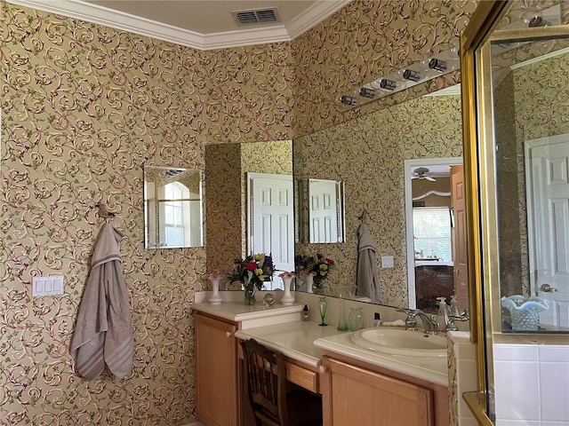 99 Auburn Dr, Kissimmee, FL 34759 - full bathroom with wallpapered walls, crown molding, healthy amount of natural light, and vanity