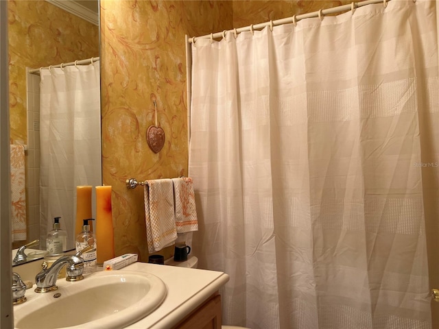 99 Auburn Dr, Kissimmee, FL 34759 - bathroom featuring vanity, wallpapered walls, and a shower with shower curtain
