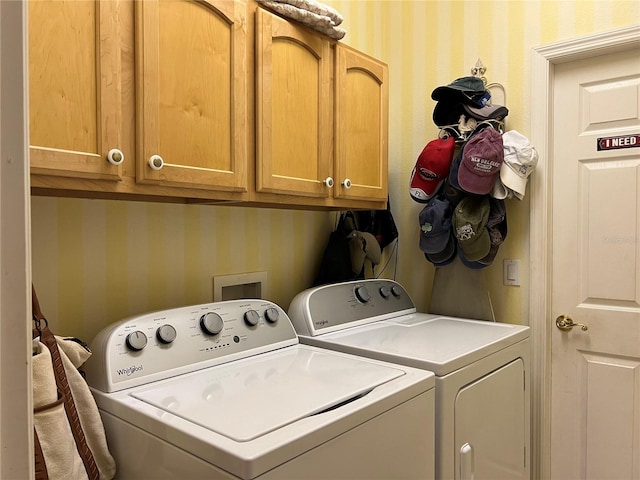99 Auburn Dr, Kissimmee, FL 34759 - laundry room with wallpapered walls, separate washer and dryer, and cabinet space