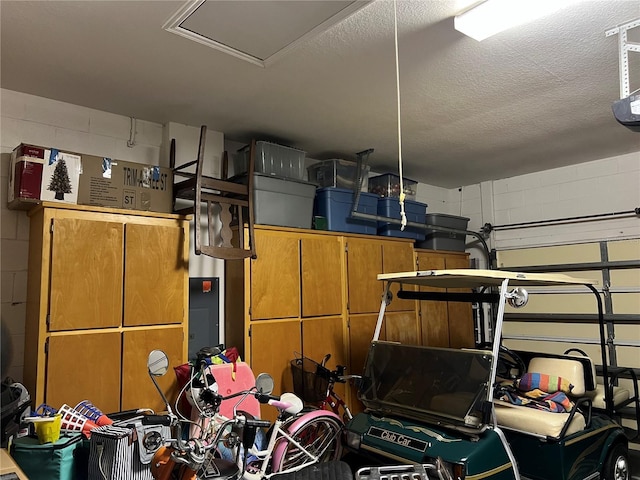 99 Auburn Dr, Kissimmee, FL 34759 - garage featuring concrete block wall