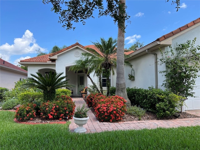 99 Auburn Dr, Kissimmee, FL 34759 - mediterranean / spanish home with stucco siding and a tiled roof