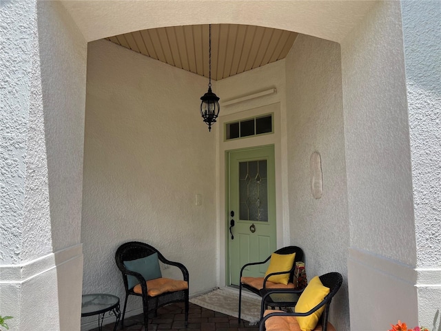99 Auburn Dr, Kissimmee, FL 34759 - doorway to property with stucco siding and a balcony