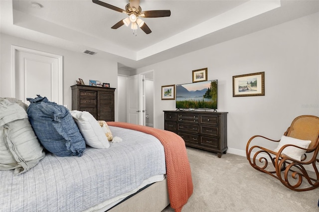14728 Scott Key Dr, Winter Garden, FL 34787 - bedroom featuring a raised ceiling, light carpet, and ceiling fan