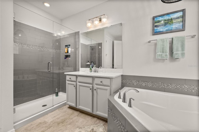 14728 Scott Key Dr, Winter Garden, FL 34787 - bathroom with a shower stall, vanity, a garden tub, and recessed lighting